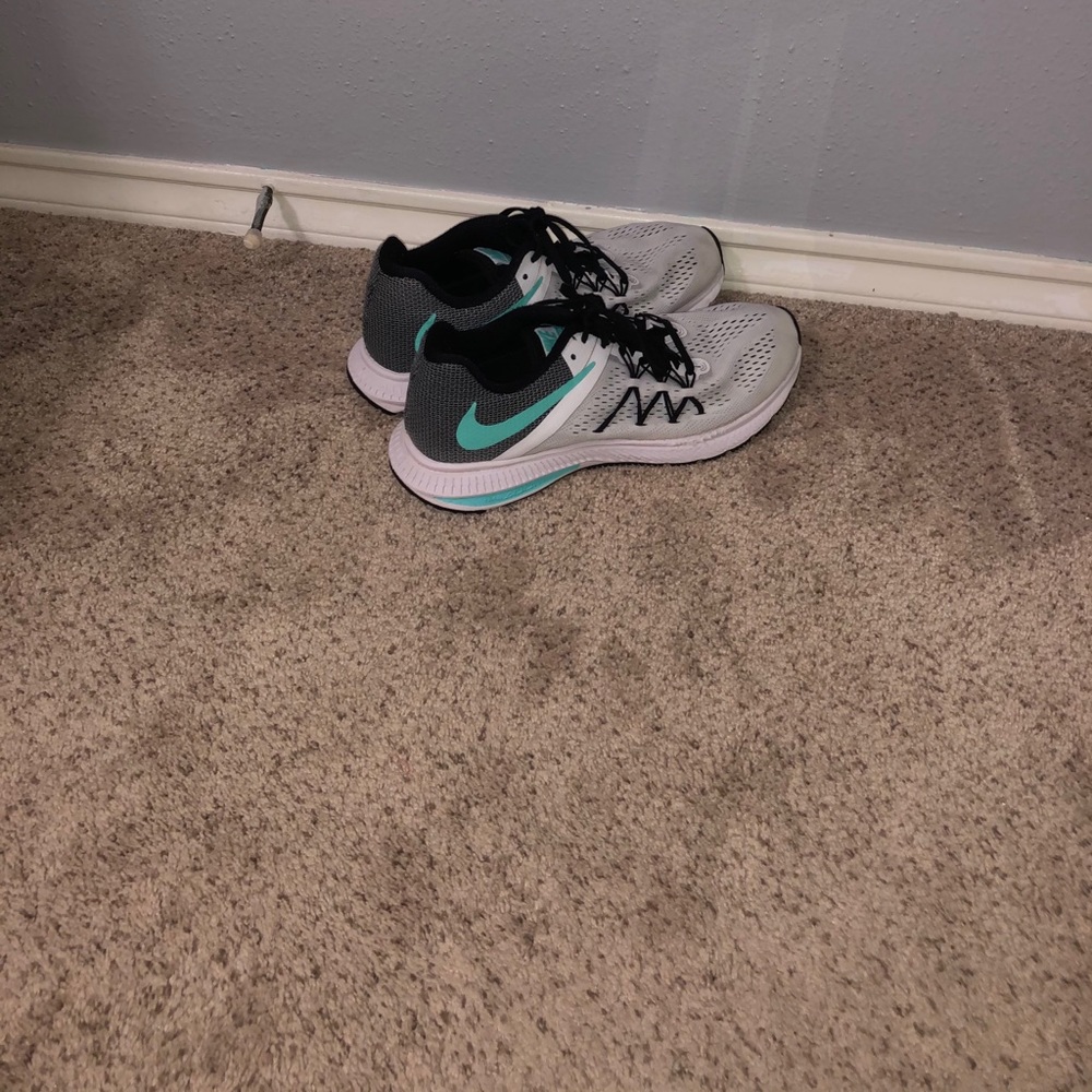 White and blue Nike running shoes
